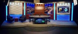 Tv set design with Led lights and a news interview desk in the front