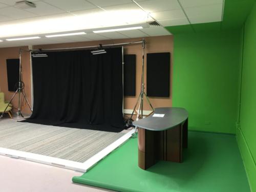 Curved news desk and green screen 