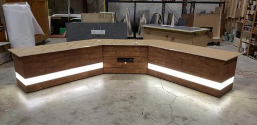 Custom Transition Panel Desk with Faux wood skin and white LED lights 